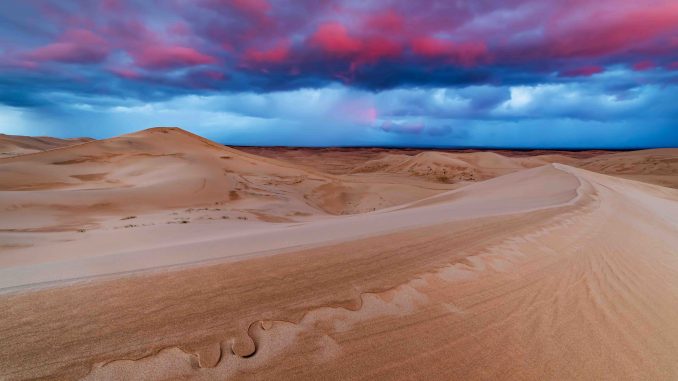 sunset over sand dunes