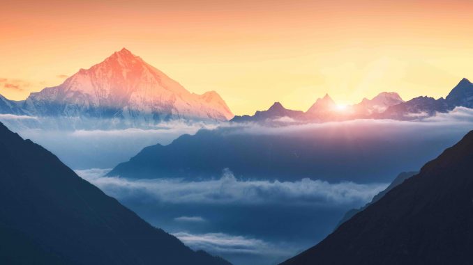 Mountains and low clouds at sunrise in Nepal